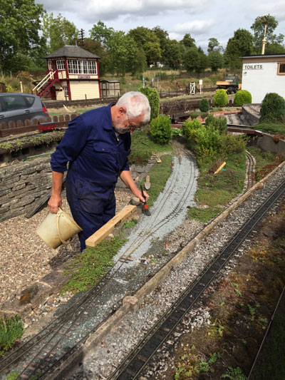 Mike brushing ballast